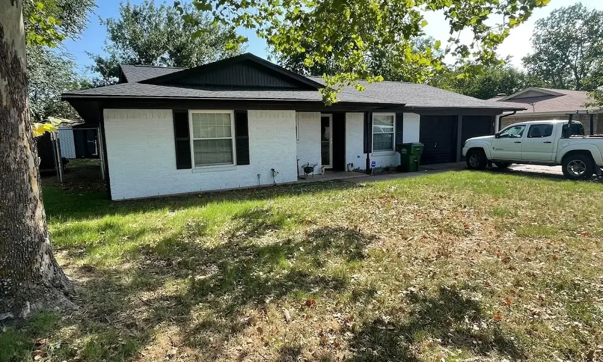 Professional roofing crew working on a residential roof in Granite City